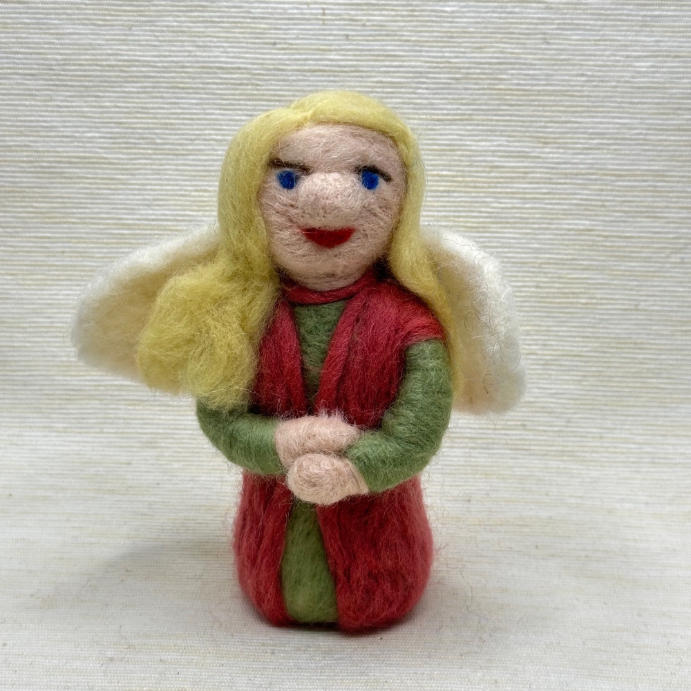 Kleiner pink-farbiger und grüner Engel